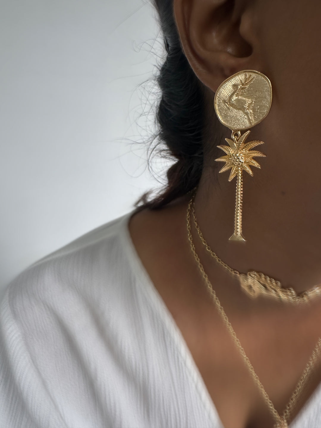 Buck palm earrings