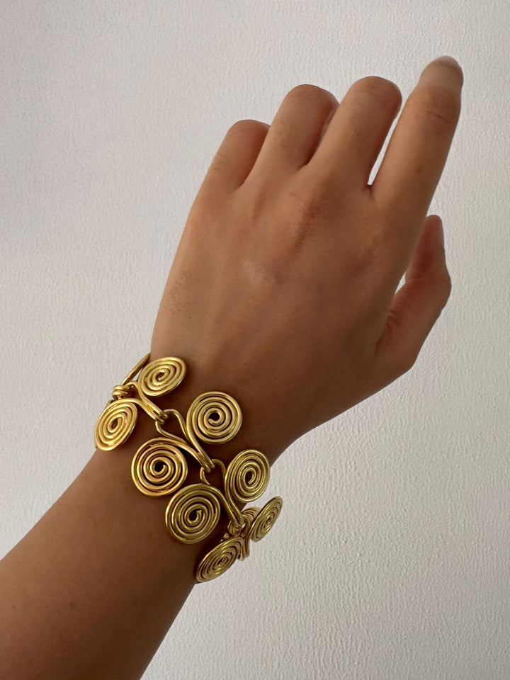 Spiral story bracelet